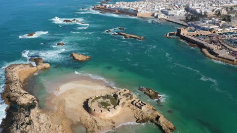 Nice-Aerial-Reveal-Of-The-City-Of-Essaouira-Morocco-And-Ruins-On-Small-Island-Offshore