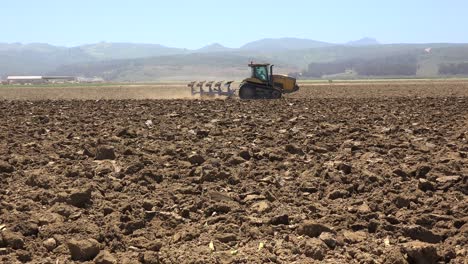 Farm-Tractor-Moves-Across-Dry-Dusty-Landscape-In-California-Suggesting-Drought-And-Climate-Change-5