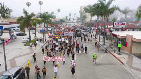 Excellent-Vista-Aérea-Over-Crowds-Large-Black-Lives-Matter-Blm-Protest-March-Marching-Through-A-Small-Town-Ventura-California
