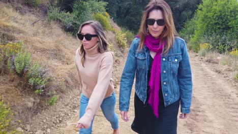 A-Mother-And-Daughter-Walk-In-Slow-Motion-On-A-Trail-In-The-Mountains-Of-Santa-Barbara-California
