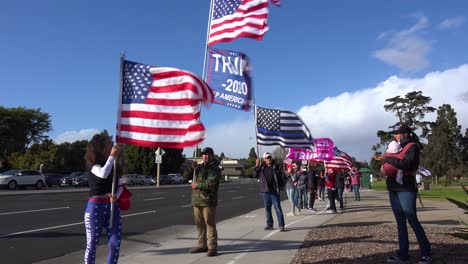 Trump-Supporters-Protest-Election-Fraud-In-The-Us-Presidential-Elections-With-Large-Flags-Flying-On-The-Street-In-Ventura-California-2