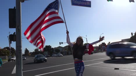 Trump-Supporters-Protest-Election-Fraud-In-The-Us-Presidential-Elections-With-Large-Flags-Flying-On-The-Street-In-Ventura-California-3