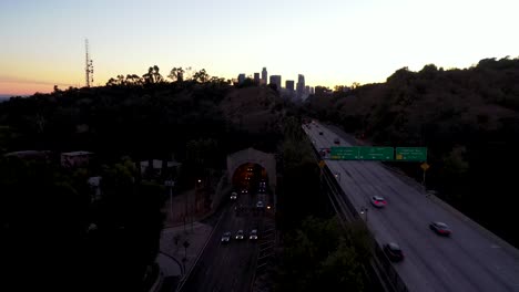 Night-Or-Dusk-Aerial-Over-The-110-Pasadena-Harbor-Freeway-And-Traffic-Leading-Into-Downtown-Los-Angeles
