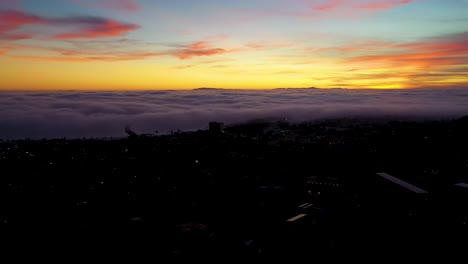 Night-Or-Dusk-Aerial-Over-Fog-Rolling-Into-Ventura-California-City-Near-Los-Angeles
