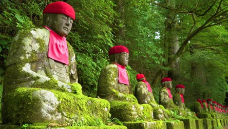 The-NarabiJizo-statues-are-seen-in-a-forested-area-of-Nikko-Japan
