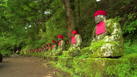 The-NarabiJizo-statues-are-seen-in-a-forested-area-of-Nikko-Japan-3