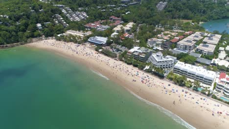 An-Aerial-View-Shows-Tourists-Enjoying-The-Beach-At-The-Shire-Of-Noosa-In-Queensland-Australia-1