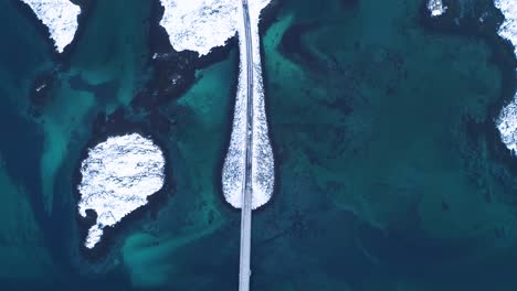 A-Bird'Seyeview-Shows-Cars-Driving-Over-Bridges-Connecting-The-Lofoten-Islands-In-Norway-In-Wintertime
