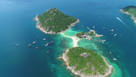 An-Aerial-View-Shows-Boats-Anchored-Near-And-Tourists-Relaxing-On-The-Interconnected-Ko-Tao-Islands-In-Thailand-1