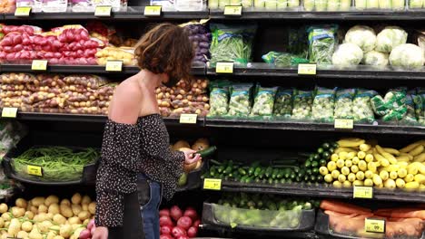 A-woman-in-mask-shops-in-the-produce-section-of-a-supermarket-during-the-Covid19-coronavirus-pandemic-epidemic-3