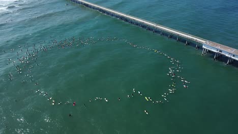 Aerial-over-surfers-in-circle-during-BLM-Black-Lives-Matter-Paddle-For-Freedom-gathering-in-California-1