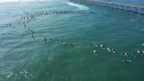 Aerial-over-surfers-in-circle-during-BLM-Black-Lives-Matter-Paddle-For-Freedom-gathering-in-California-6