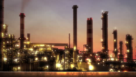 Panorama-of-city-landscape-with-many-big-factory-pipes-in-sunset-summer-day