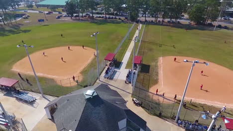 Aerial-Around-Four-Separate-Baseball-Diamonds-At-A-Local-Park-Or-Sports-Complex
