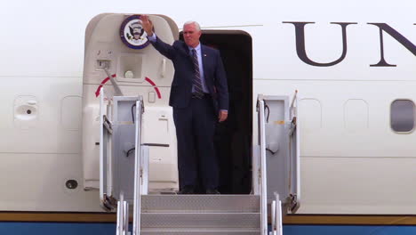 Vice-President-Mike-Pence-Emerges-From-Air-Force-Two-And-Waves-And-Salutes-To-Those-Gathered