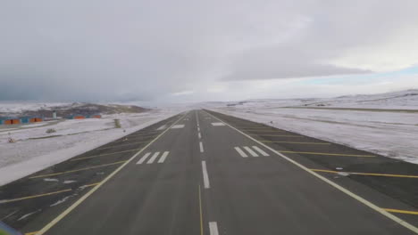 Pov-Of-A-Plane-Coming-In-For-A-Landing-On-An-Icy-Runway-In-The-Arctic