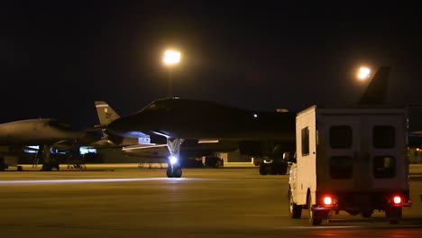 American-B1B-Nuclear-Bombers-Taxi-On-The-Runway-At-An-Airbase-At-Night-1