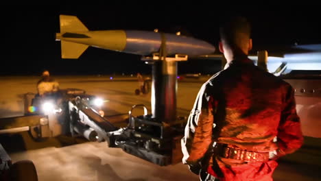 Bombs-Are-Loaded-Onto-An-American-B1B-Bomber-At-An-Air-Base-At-Night-In-Advance-Of-A-Bombing-Mission-2