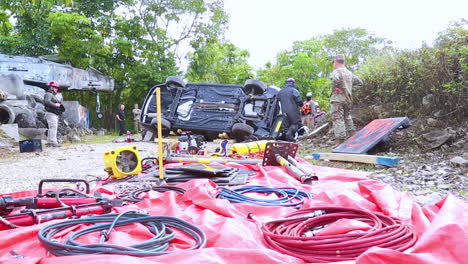 At-A-Fire-Rescue-Urban-Search-And-Rescue-Training-Site-Members-Of-The-Us-Army-Reserve-Break-Into-A-Crashed-Car-To-Save-A-Mannequin-Inside