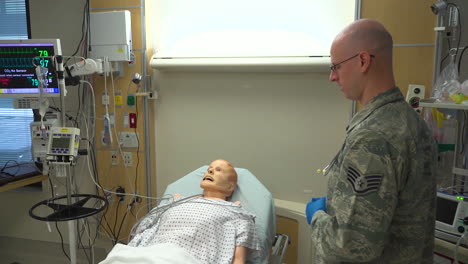 Usaf-Doctors-In-Training-Work-On-A-Mannequin-In-A-Hospital-Bed
