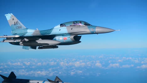 A-Usaf-Pilot-With-The-18Th-Aggressor-Squadron-Flies-His-F16-Fighting-Falcon-In-Blue-Skies-Over-Alaska