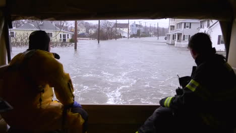 The-Massachusetts-National-Guard-And-Quincy-Firefighters-Drive-Through-A-Flooded-Area