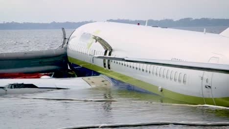 An-Airplane-that-Overran-the-Runway-At-the-Miami-International-Airport-Sits-In-Shallow-Water-With-Its-Emergency-Doors-Open-May-6th-2019