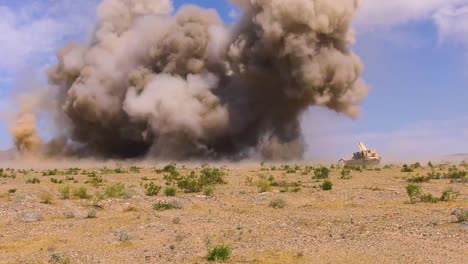 A-Huge-Explosion-Goes-Off-In-Front-Of-A-M1150-Assault-Breacher-Vehicle-thats-Sweeping-A-Battlefield-For-Mines-2019