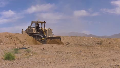 A-Bulldozer-Creates-A-Path-On-A-Battlefield-For-Tanks-During-Training-2019