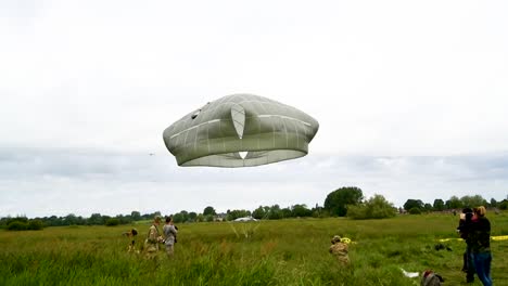 A-Paratrooper-As-He-Lands-In-A-Field-Near-Saintemereeglise-France-For-the-75th-Commemoration-Of-Dday-June-9th-2019