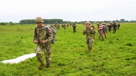 Paratroopers-Walk-Across-A-Field-Near-Saintemereeglise-France-After-Landing-For-the-75th-Commemoration-Of-Dday-June-9th-2019