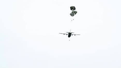 View-From-the-Ground-As-Paratroopers-Jump-Out-Of-A-World-War-2-Era-Plane-Near-Saintemereeglise-France-For-the-75th-Commemoration-Of-Dday-June-9th-2019