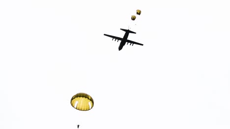 Dozens-Of-Paratroopers-As-they-Jump-Out-Of-A-World-War-Ii-Era-Plane-And-Float-Down-To-A-Field-Near-Saintemereeglise-France-For-the-75th-Commemoration-Of-Dday-2019