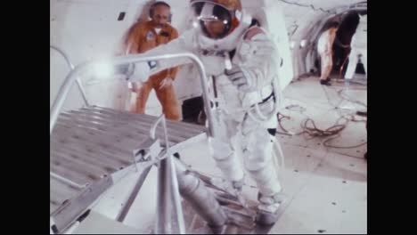 Astronauts-Neil-Armstrong-And-Buzz-Aldrin-Practice-Climbing-A-Ladder-In-their-Space-Suits-1969