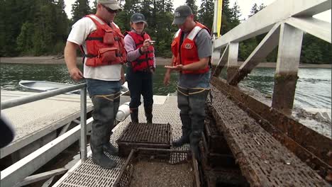 Men-Work-On-A-Floating-Aquaculture-Shellfish-Farm-In-the-Us-2010S