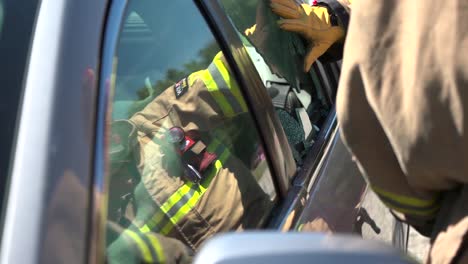 Firefighters-Demonstrate-How-To-Break-Into-A-Car-In-Case-Of-A-Fire-Emergency
