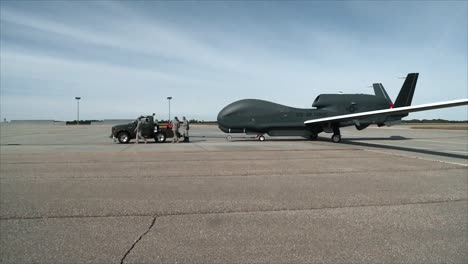 A-Usaf-Northrop-Grumman-Rq4-Global-Hawk-Is-Towed-Along-A-Runway-At-An-Air-Base