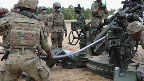 Soldiers-Assigned-To-A-Field-Artillery-Regiment-Train-By-Loading-And-Firing-A-M777-Howitzer-At-Fort-Bragg-North-Carolina