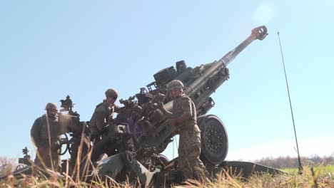 Us-Army-Soldiers-Load-And-Fire-A-M777-Howitzer-Cannon-During-Bold-Quest-202-Exercises-Camp-Atterbury-In