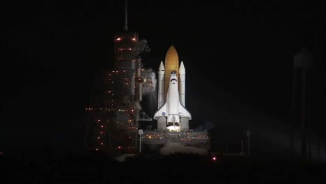 The-Space-Shuttle-Discover-Launches-At-Night