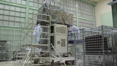 Scientists-Work-In-A-Heavily-Controlled-Lab-To-Prepare-A-Satellite-At-Nasa