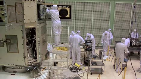 Scientists-Work-In-A-Heavily-Controlled-Lab-To-Prepare-A-Satellite-At-Nasa-2