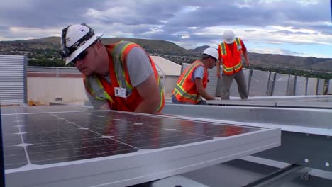 A-Maintenance-And-Installation-Team-Works-On-Solar-Panel-Arrays