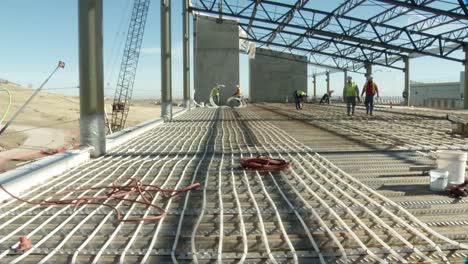 Heating-Is-Distributed-Under-A-Building-Through-Radiant-Piping-During-Construcción