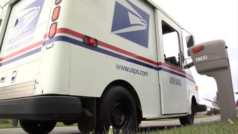 Us-Postal-Vehicles-Deliver-Mail-In-Suburban-Neighborhoods-2