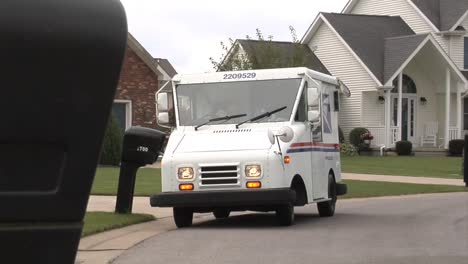 Us-Postal-Vehicles-Deliver-Mail-In-Suburban-Neighborhoods-3