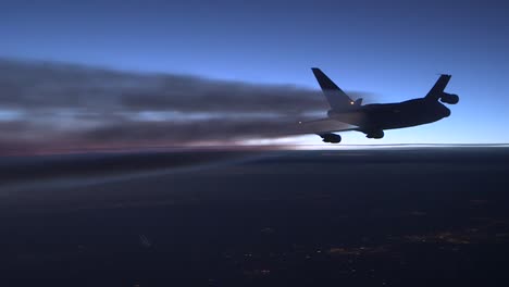 A-Generic-Airplane-In-Flight-At-Sunset-With-Contrail