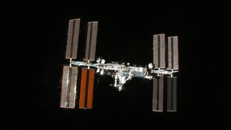 The-International-Space-Station-Flies-Against-A-Black-Background-1
