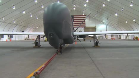 Good-Dolly-Shot-Of-A-Us-Rq4-Drone-Surveillance-Aircraft-In-A-Hangar