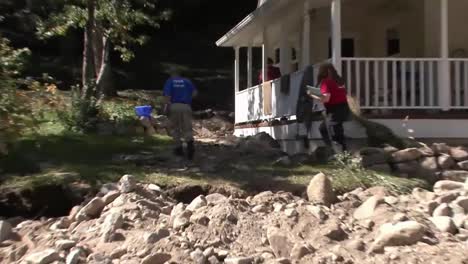 Fema-Relief-And-Aid-Workers-Interview-Homeowners-Following-A-Disastrous-Flood